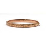 A 9ct gold hollow hinged bangle,