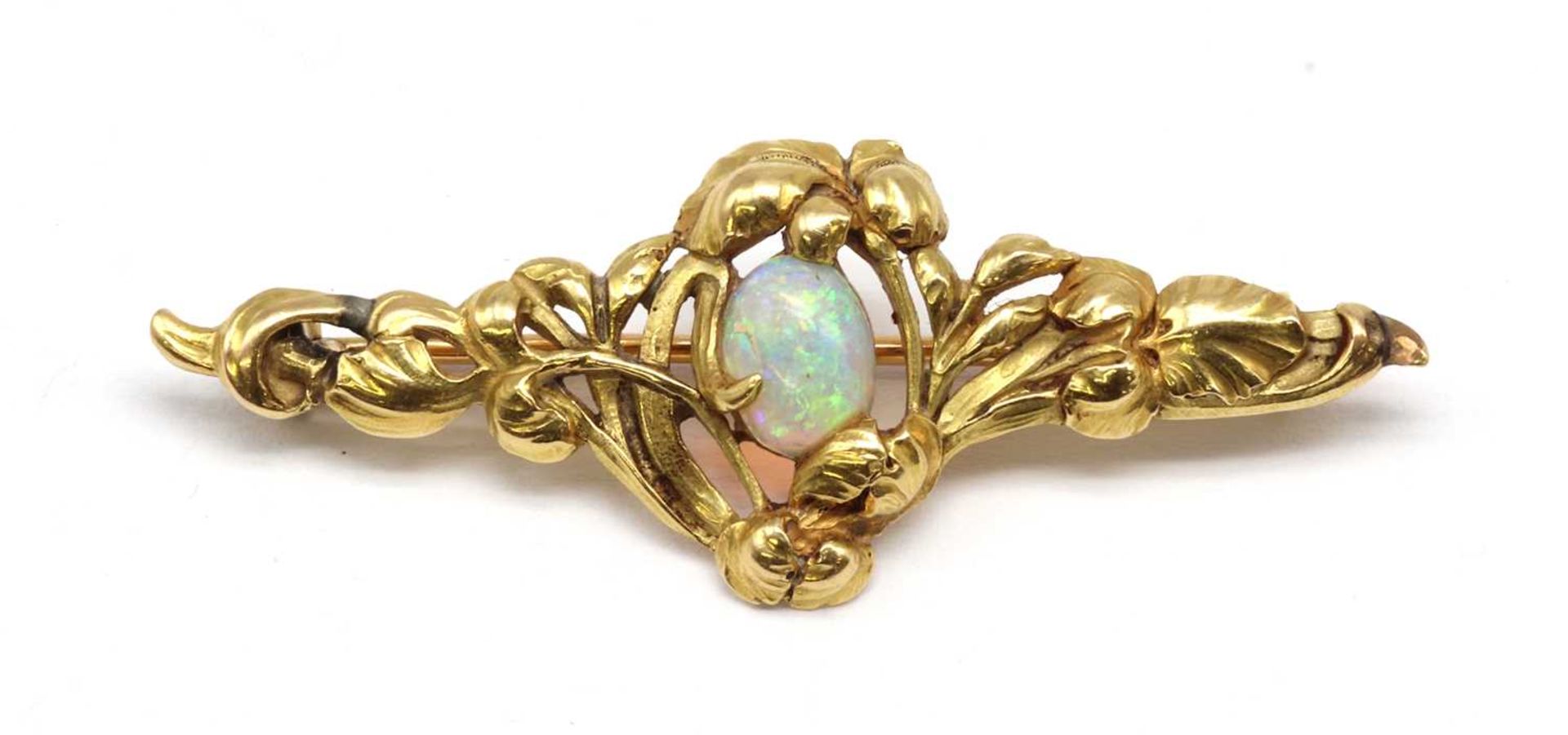 A French Art Nouveau gold single stone opal bar brooch,