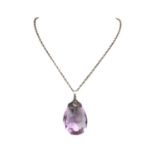 An Arts & Crafts style silver amethyst pendant,