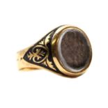 A gold memorial ring,