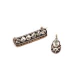 A silver and gold diamond set bar brooch,