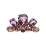 A silver gilt amethyst fan brooch,