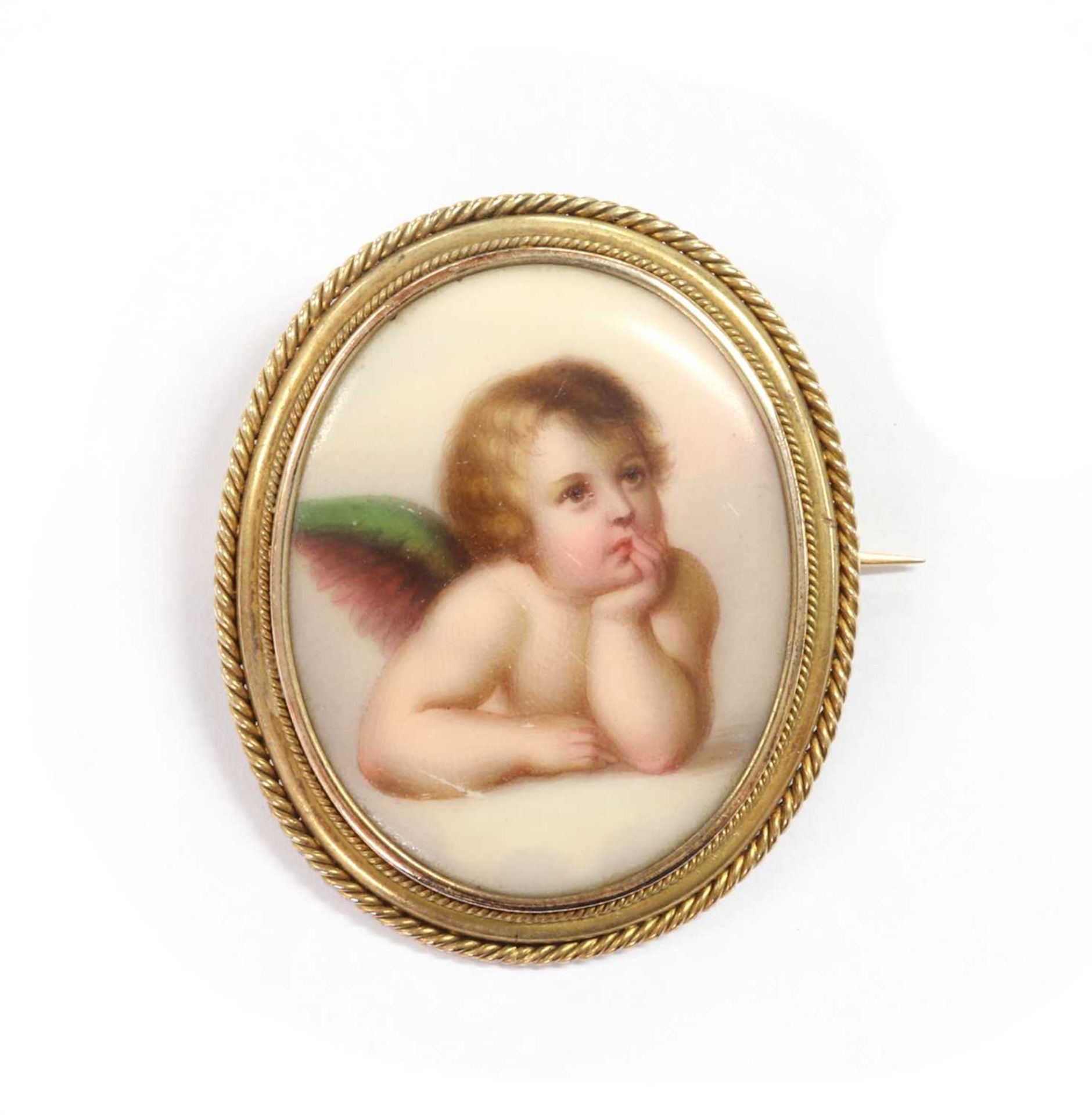 A gold mounted porcelain plaque brooch,