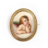 A gold mounted porcelain plaque brooch,