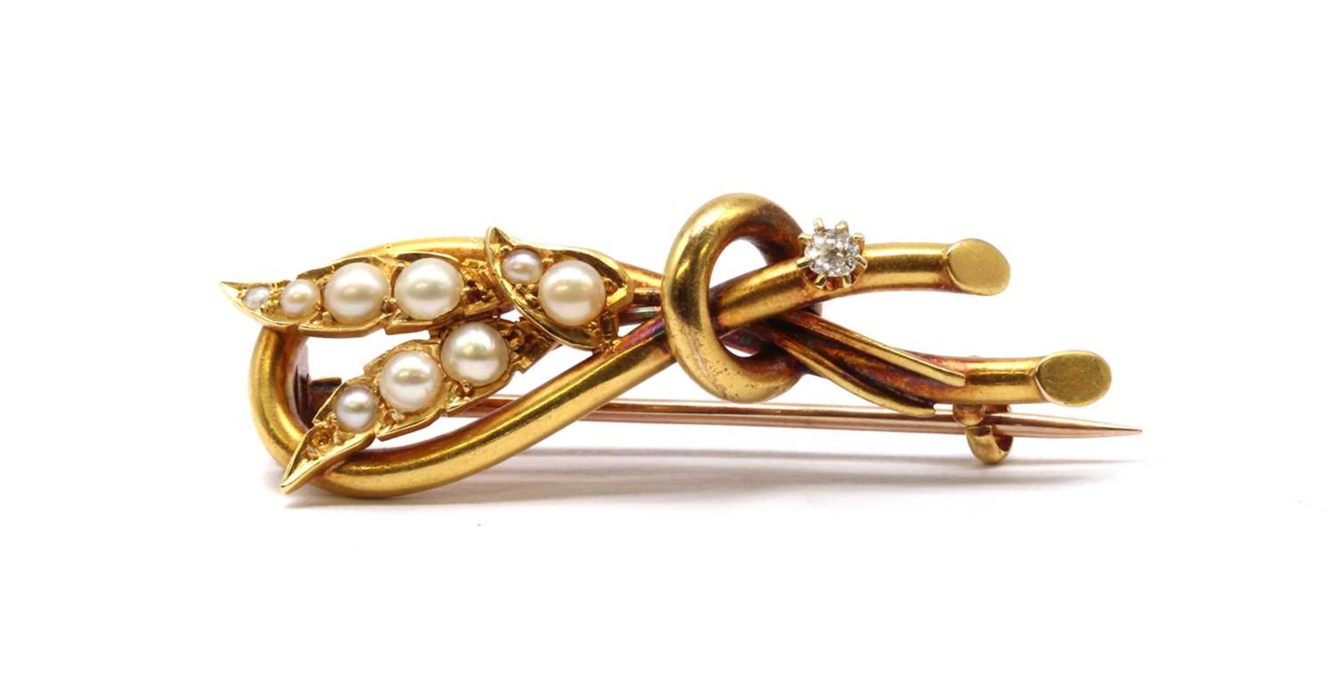 A late Victorian gold split pearl and diamond spray brooch,