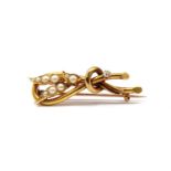 A late Victorian gold split pearl and diamond spray brooch,