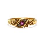 An 18ct gold ruby and diamond three stone ring,