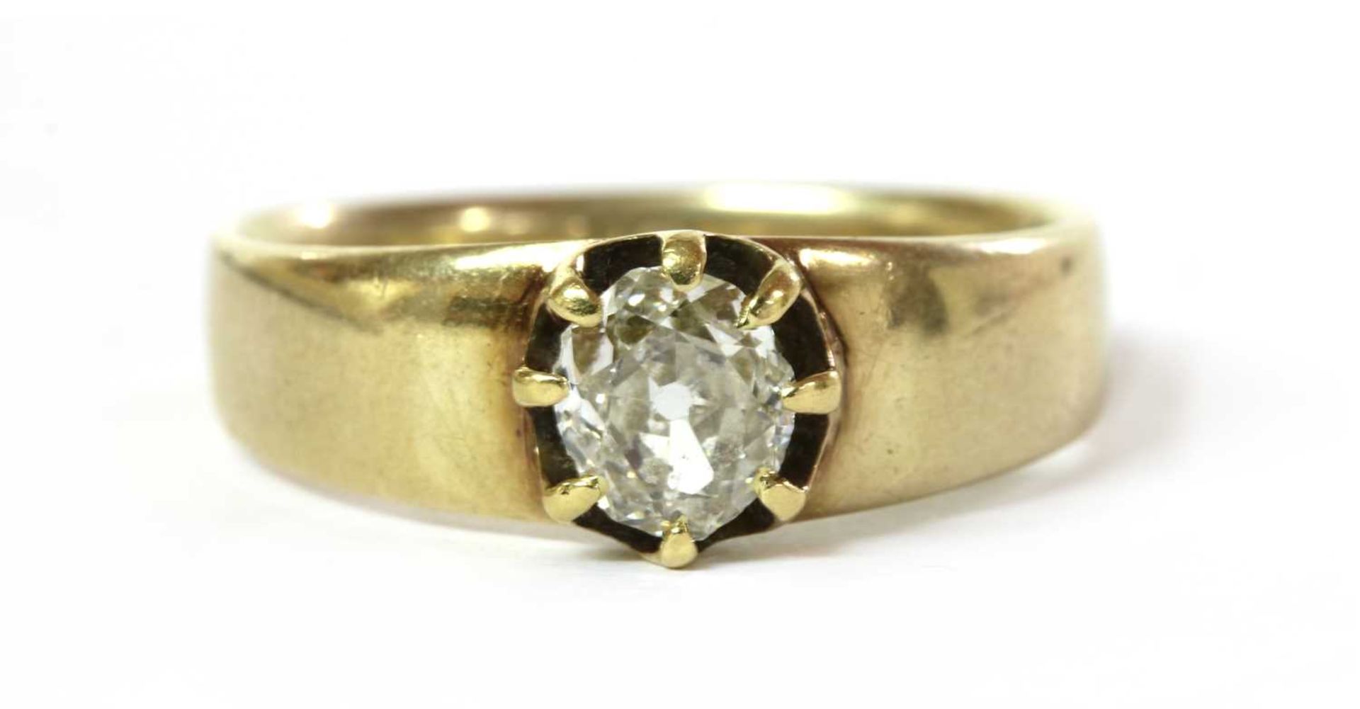 A gold single stone diamond ring,