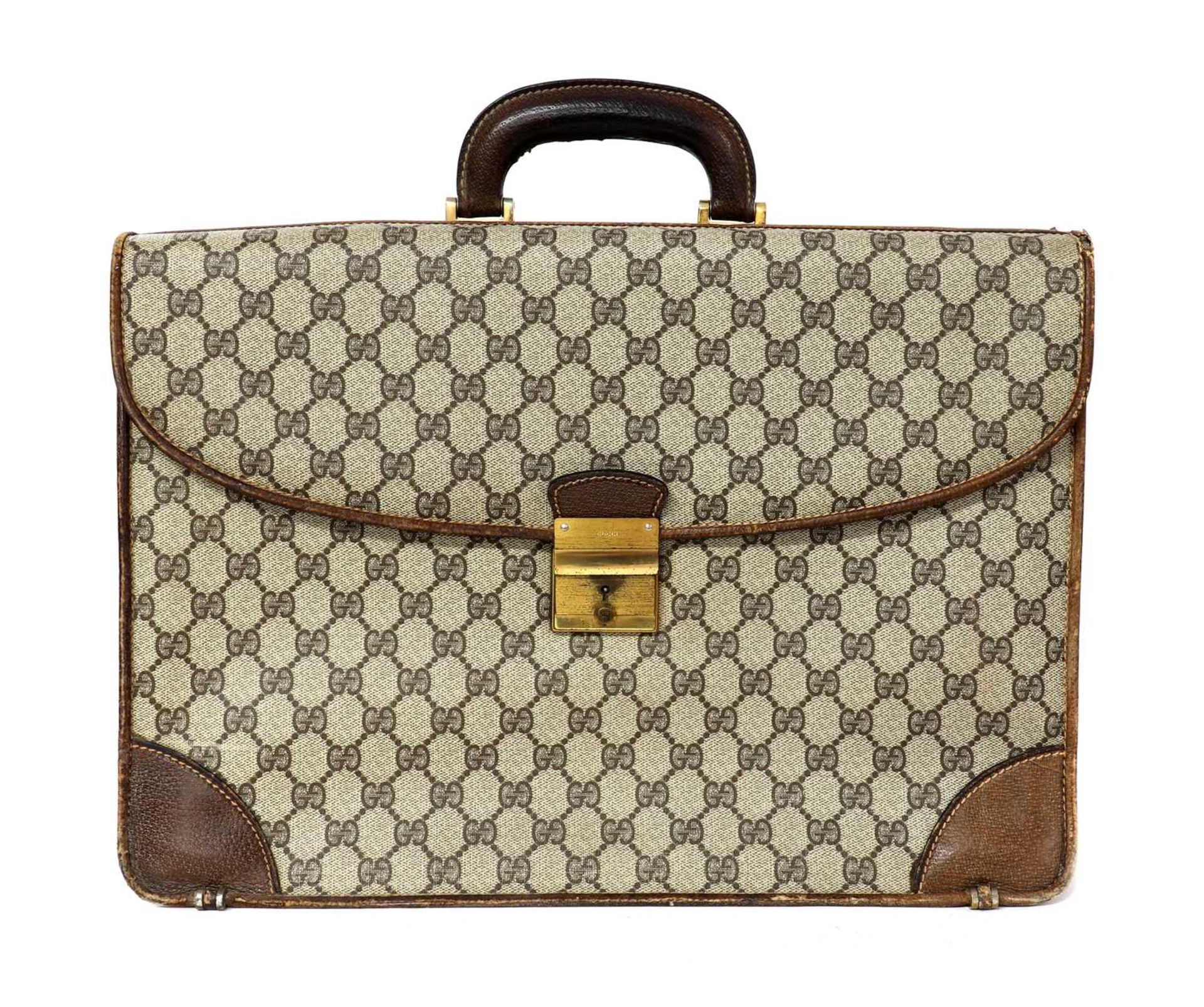 A vintage Gucci brown coated canvas briefcase,