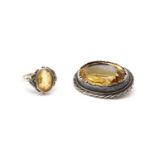 An Arts & Crafts silver single stone citrine ring,