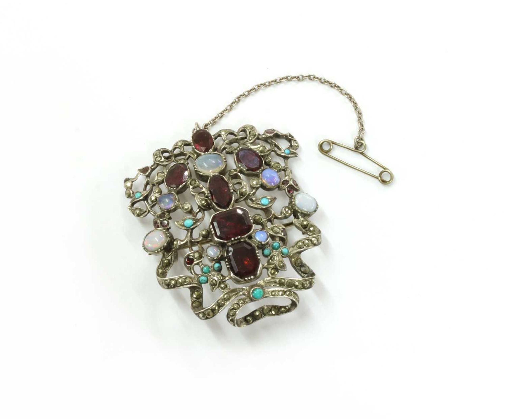 A silver assorted gemstone plaque,