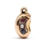 A Victorian 9ct gold hollow bean charm,