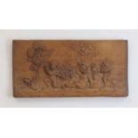 A carved wooden plaque,