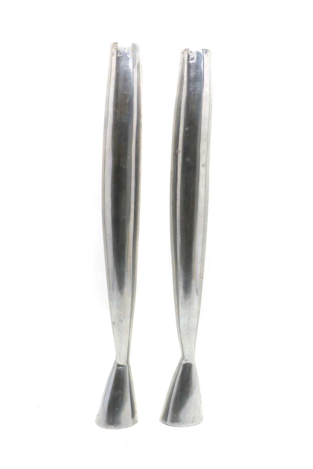 A pair of polished steel candlesticks,