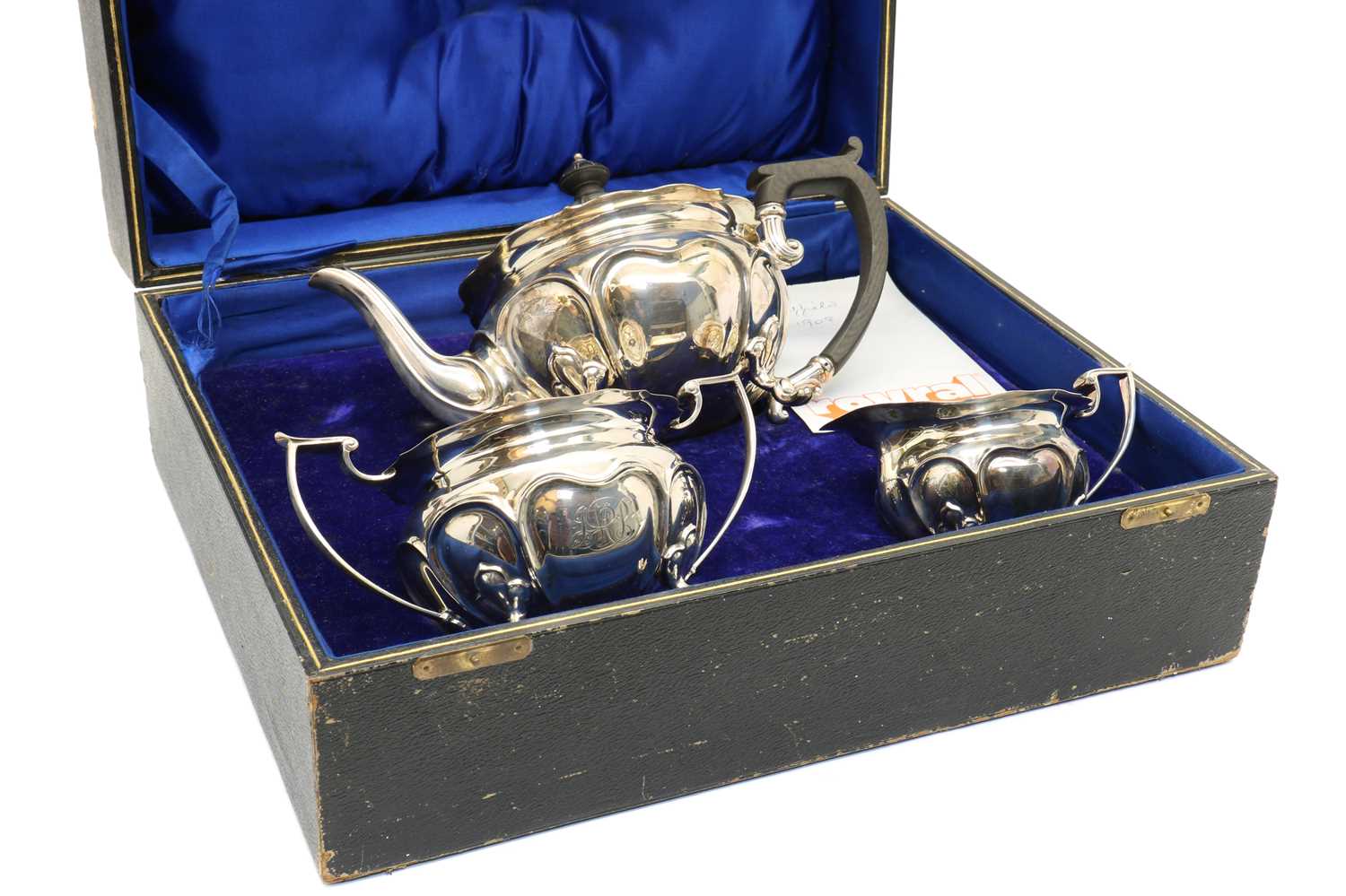 A cased three piece Edwardian silver tea service,