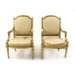 A pair of Louis XVI style giltwood armchairs