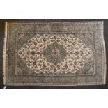 A signed Kashan carpet,