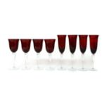 A set of red glass drinking glasses,