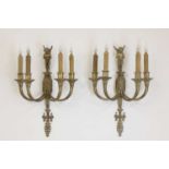 A pair of four-branch gilt-metal wall lights,