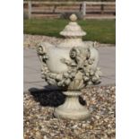 A composite stone urn and cover,