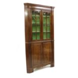 A George III mahogany standing corner cupboard,