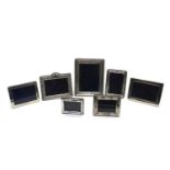 A collection of seven silver mounted frames,