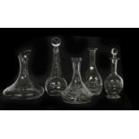 A collection of glass decanters and carafes,
