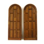 A pair of oak arched top panelled doors and frames,