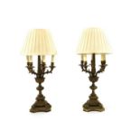 A pair of cast brass six-light candelabra,