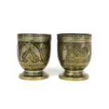 A pair of bidri brass vases,