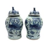 A pair of Chinese blue and white vases and covers,