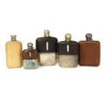 A group of five various spirit flasks,