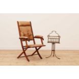 A folding leather chair by Trapnell & Gane,