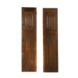 A pair of panelled oak internal doors,