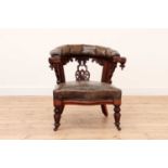 An oak and leather armchair,