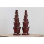A pair of red-painted toleware graduated vases,