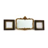 A pair of oak framed wall mirrors,