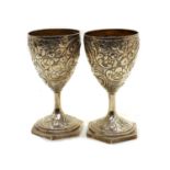 A pair of George III silver goblets