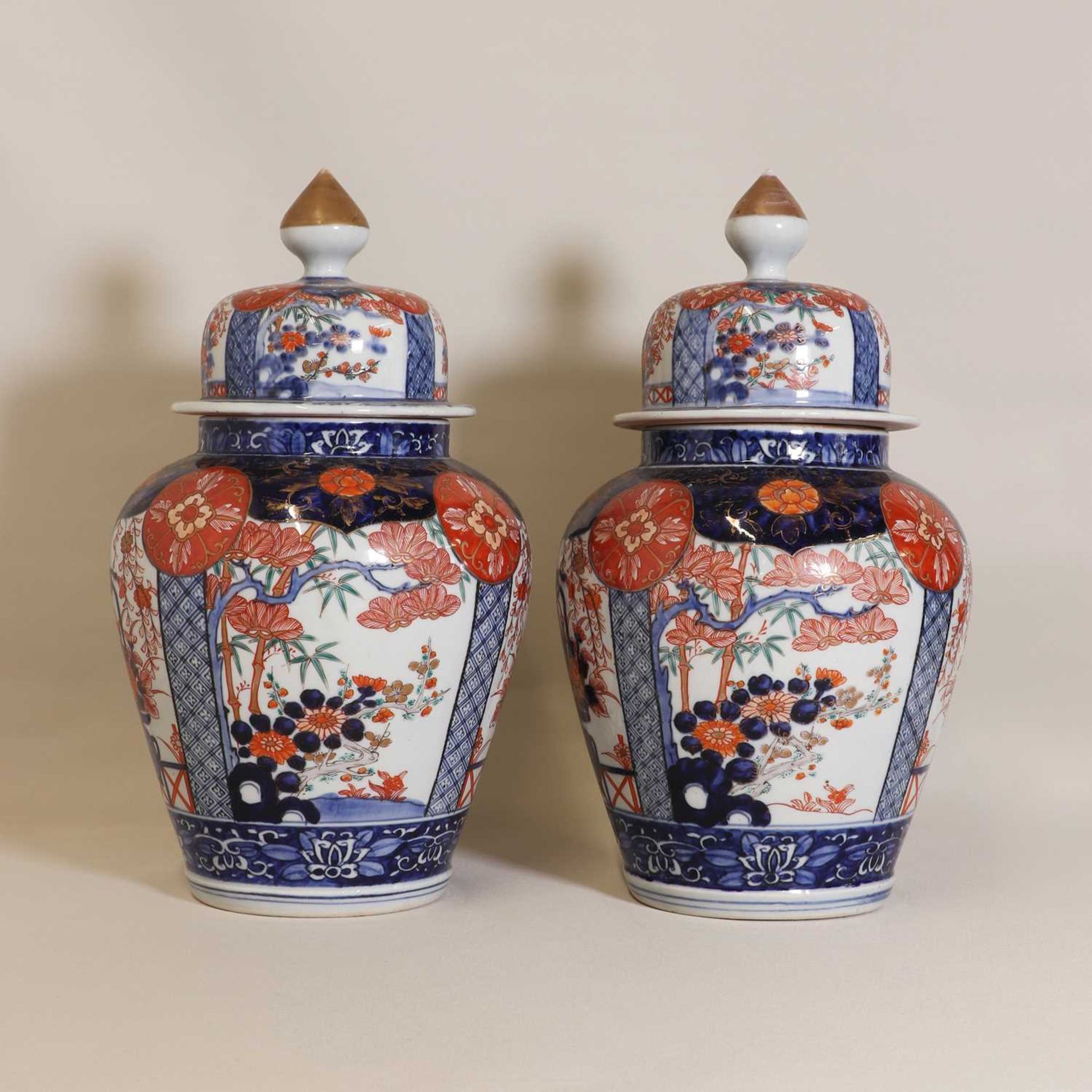 A pair of Japanese Imari vases and covers,