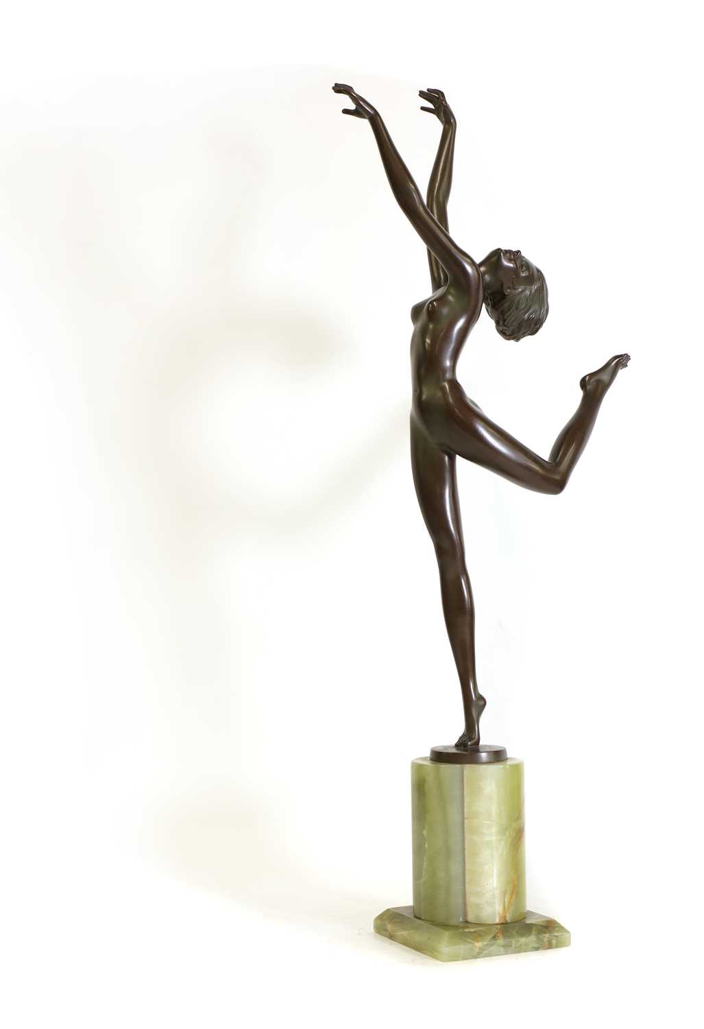 An Art Deco patinated bronze figure of a dancer,