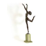 An Art Deco patinated bronze figure of a dancer,