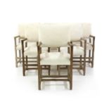 A set of six limed oak armchairs,