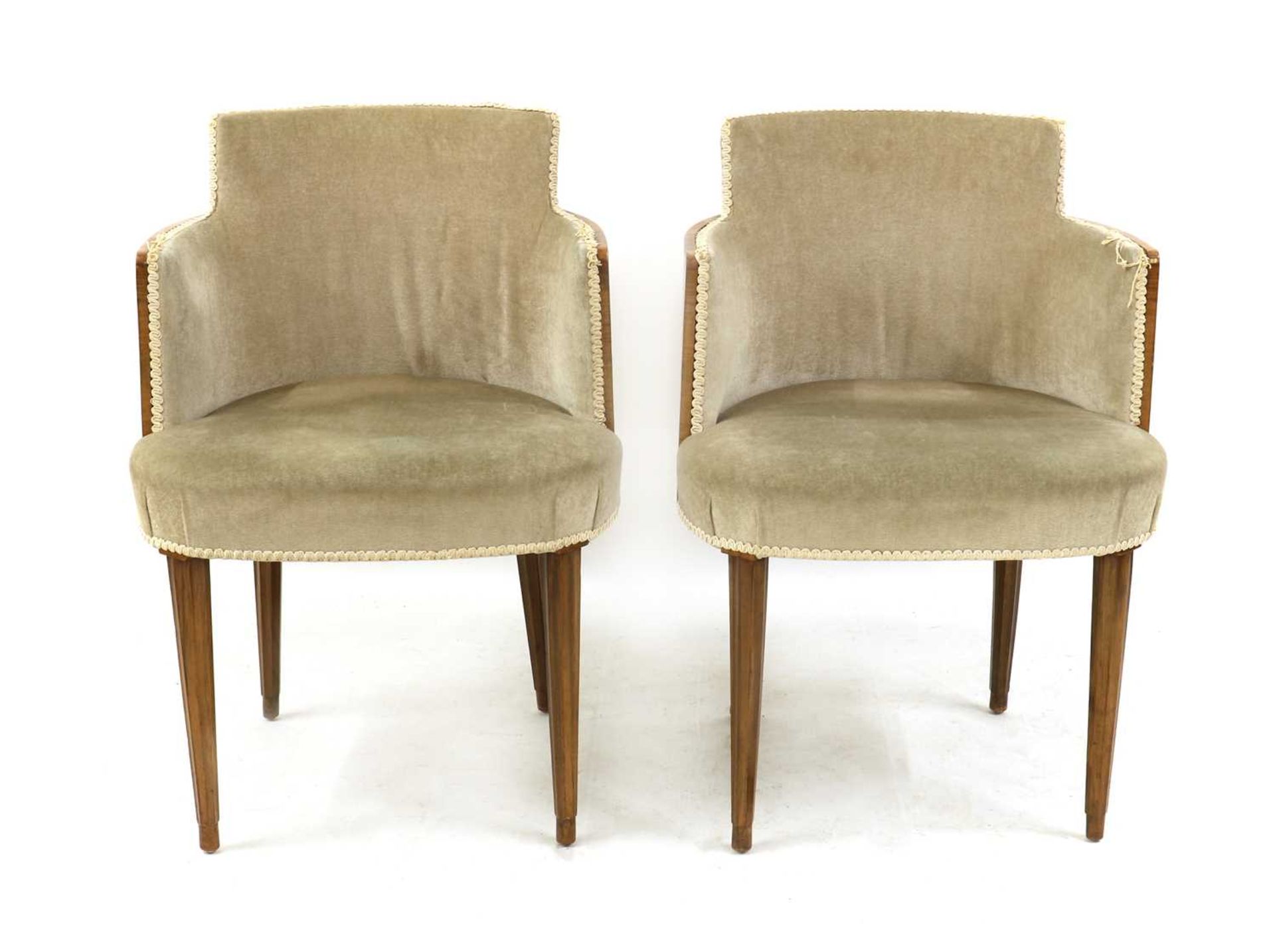 A pair of Art Deco walnut armchairs,