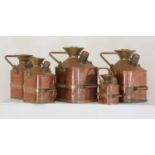 A rare set of five copper and brass imperial measure petrol cans,