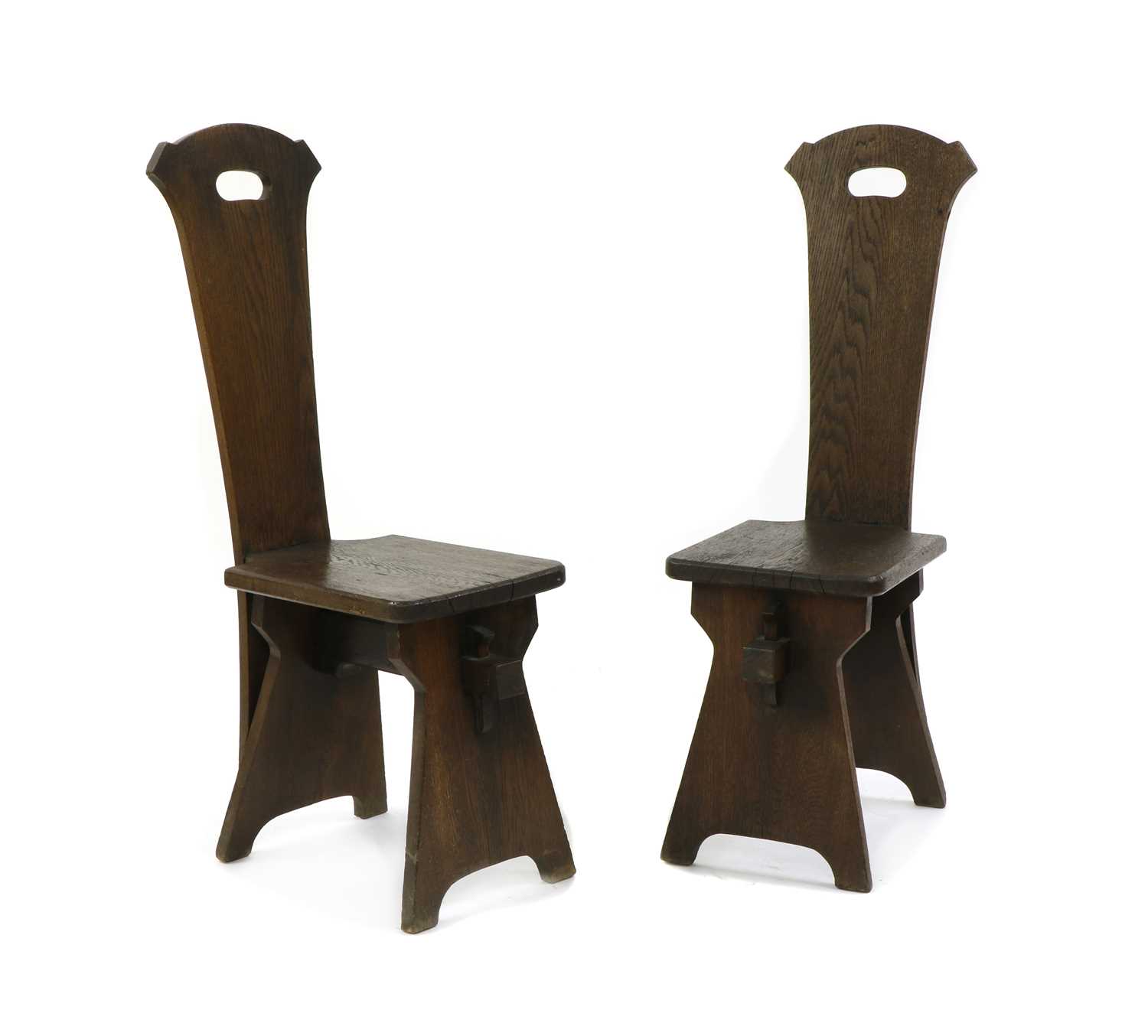 A pair of American Arts and Crafts oak hall chairs,