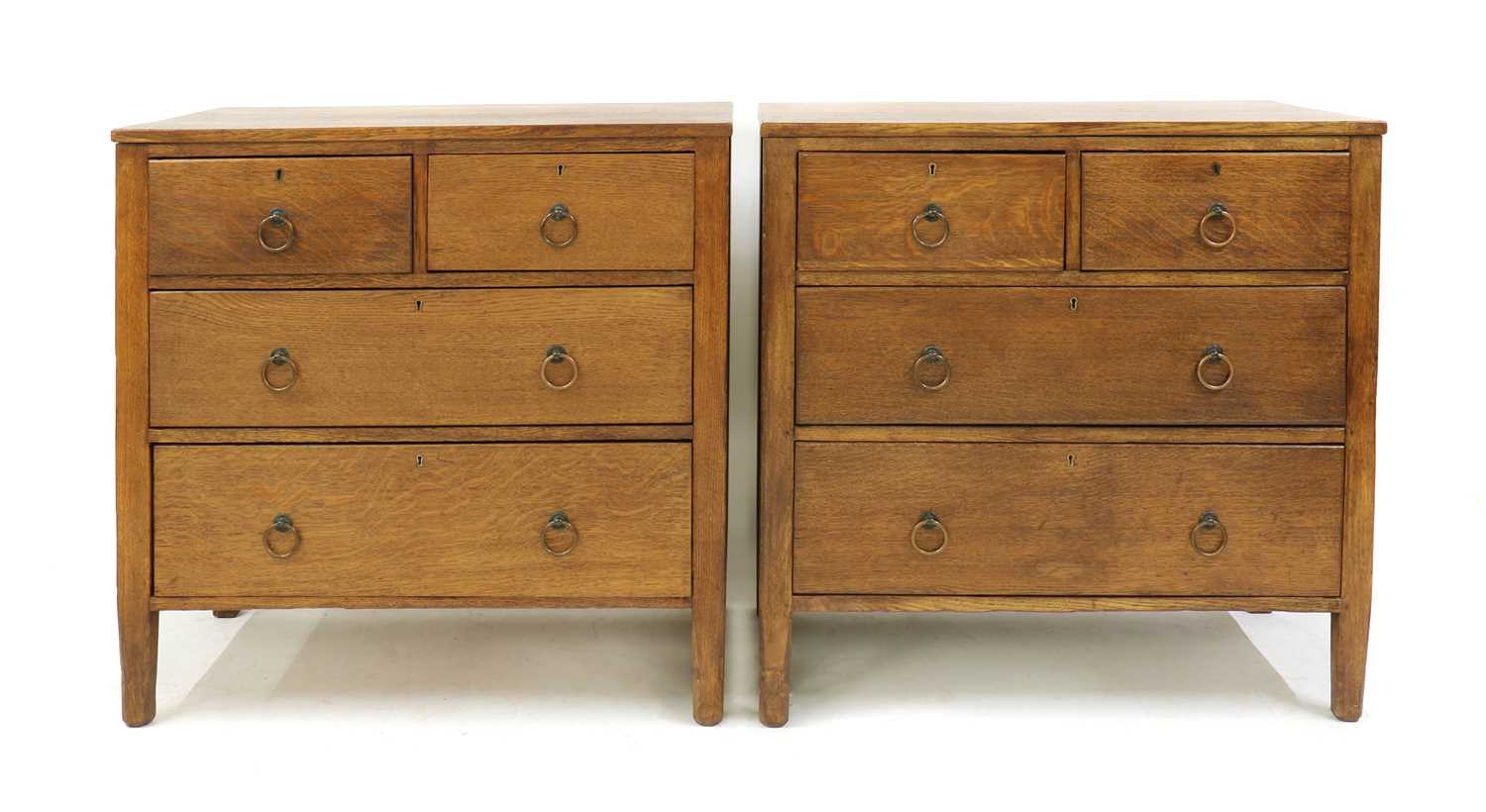 A pair of Arts and Crafts oak chests,