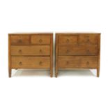 A pair of Arts and Crafts oak chests,