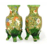 A pair of glass and enamelled vases,