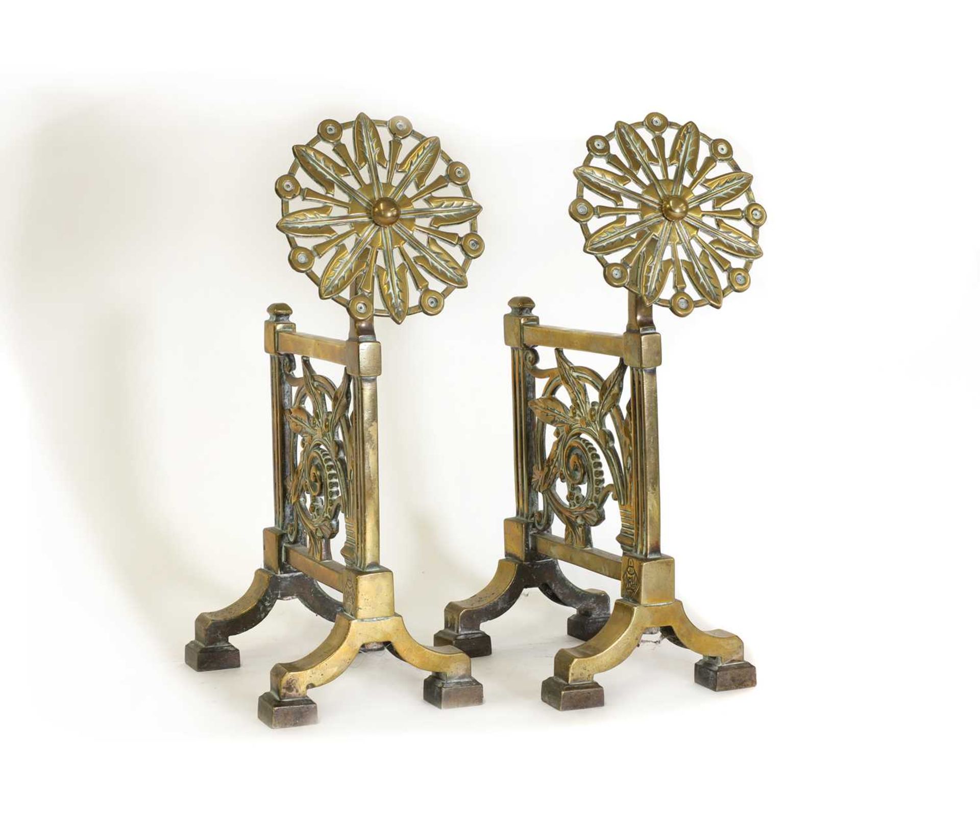 A pair of cast brass andirons,