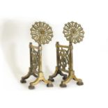 A pair of cast brass andirons,